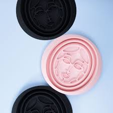 Collapsible Facial Ice Bath Bowl on pastel background with skincare accessories